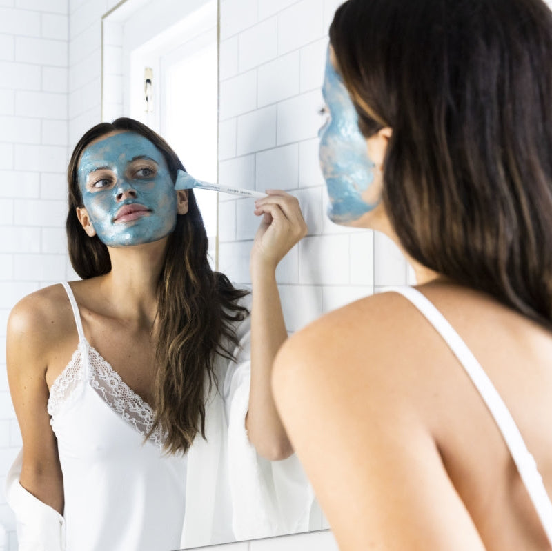 Applying a blue face mask